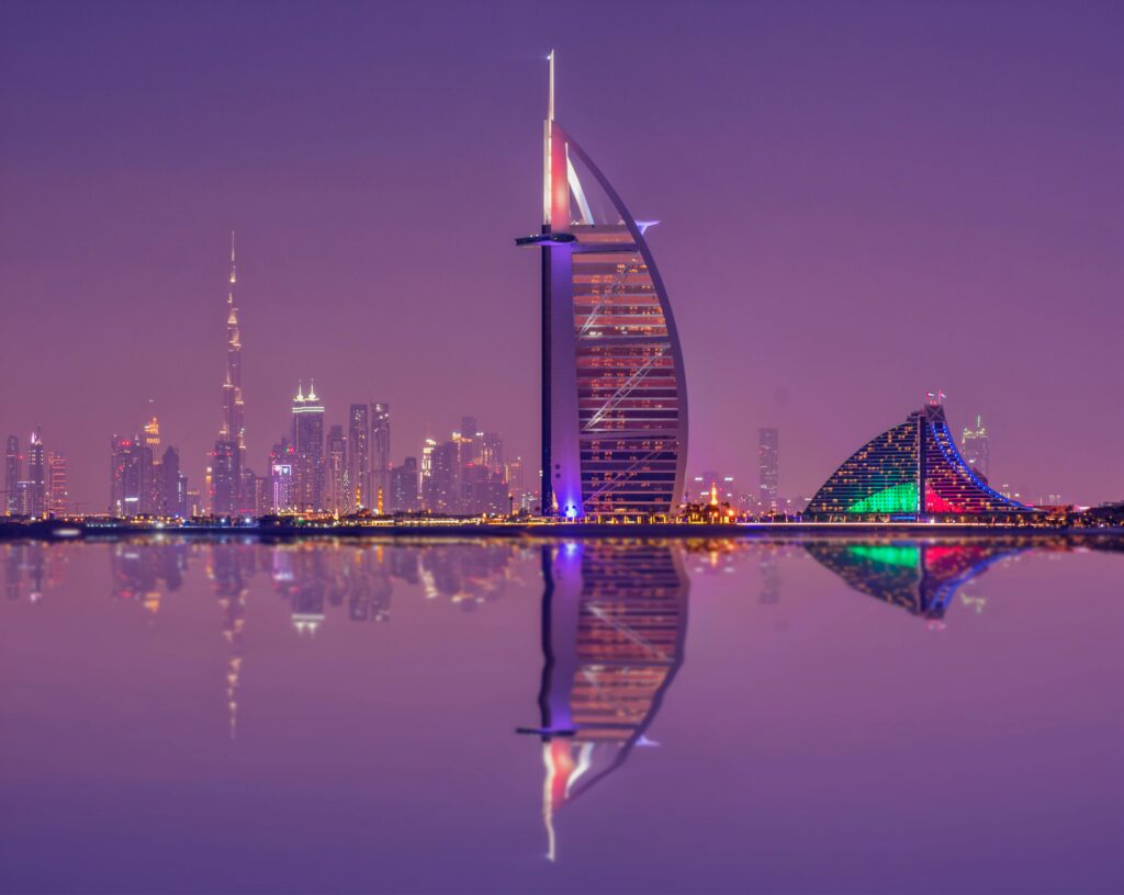 The illuminated Burj Al Arab with Dubai’s skyline at night, reflecting the city’s ultra-luxury appeal.